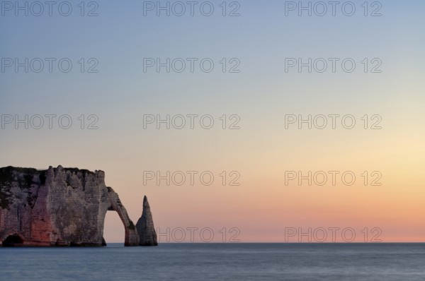 Rock arch Falaise or Porte d'Aval and rock needle Aiguille, illuminated, illuminated, Étretat, sea,