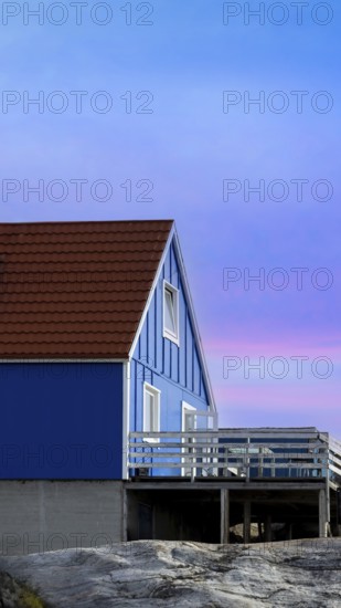 Typical architecture of Greenland Ilulissat with colored houses located near fjords and icebergs