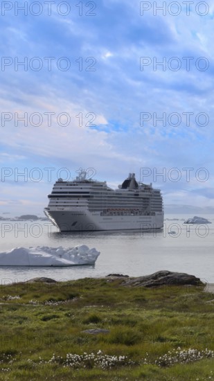 Iceberg seen from cruise ship vacation near Greenland coast in Arctic circle near Ilulissat Disko