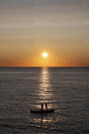 Children playing on bathing island, bathing raft, swimming island, Étretat, sea, sunset, evening