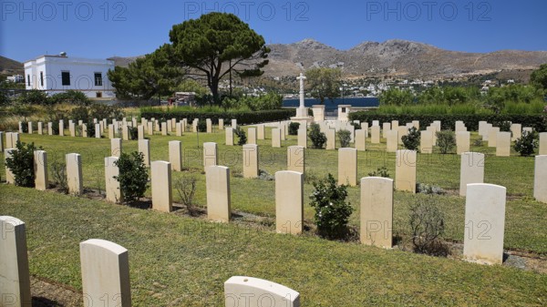 Cemetery with gravestones and sea view, surrounded by trees and mountains, Military Cemetery,