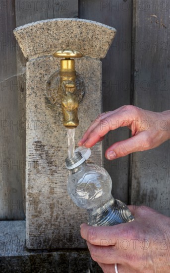 Drinking water supply at a public well, Bavaria, Germany
