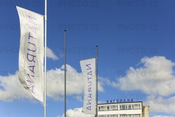 Naturana Miederfabriken, company building of Naturana Dölker Textilbekleidung, lettering, flags,