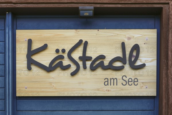 Wooden sign KäStadel am See, Kässtadel, specialist cheese shop with bistro, cheese shop,