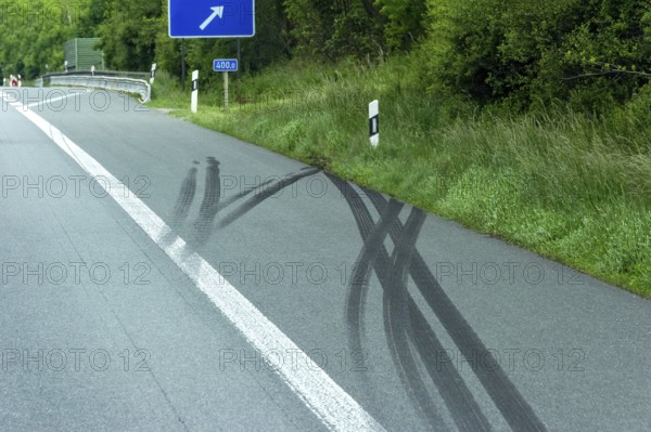 Accident scene, heavy skid marks on the hard shoulder into the embankment after an accident, A9