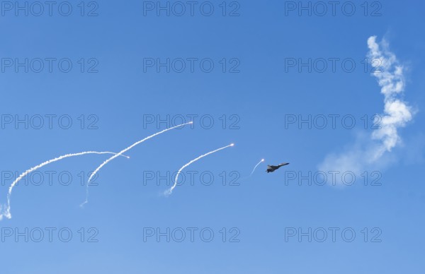 The Indian Air Force aerobatic team performs during an air show as part of the 93rd Air Force Day