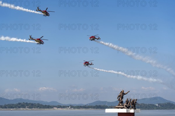 Indian Air Force (IAF) ALH Mk1 Sarang helicopters soar through the sky during an air show as part