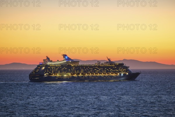 Mykonos, Cyclades, Greece - Voyager of the Seas cruise ship sails from Mykonos harbour bay towards