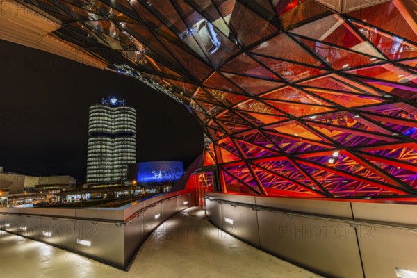 Federally illuminated BMW world, in the back the BMW Museum and the high-rise office building of