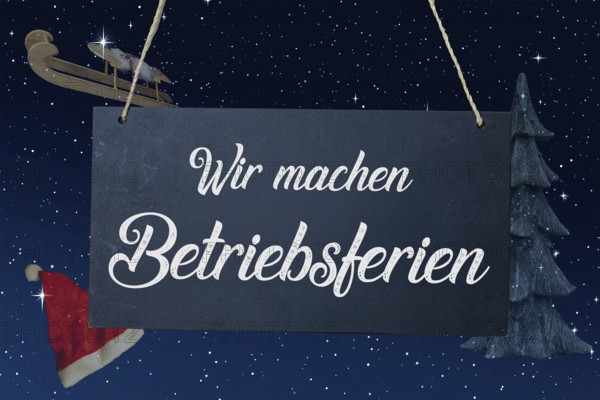 (Photo montage) Company holidays at Christmas: sign with the inscription WIR MACHEN BETRIEBSFERIEN