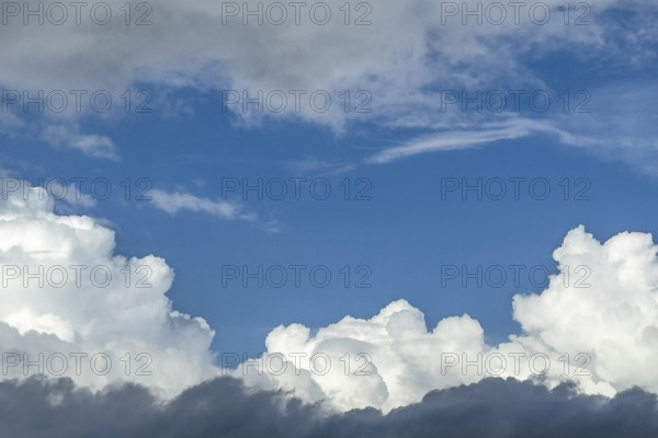 Down back Cumulus cluster clouds above part of Altostratus layer cloud in the middle window gap