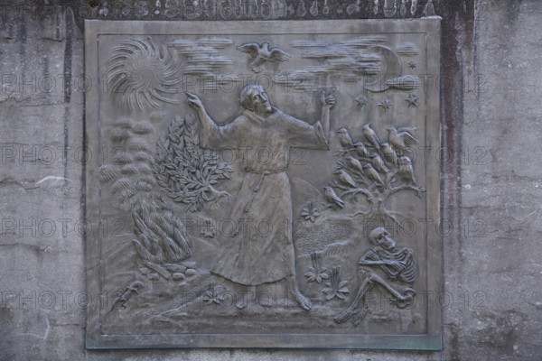 Relief of Saint Francis, Francis of Assisi, monk, monochrome, grey, skeleton, death, bird figures,