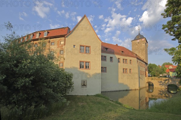 Moated castle built 12th century with tower, arched bridge with pond, medieval Kapellendorf,