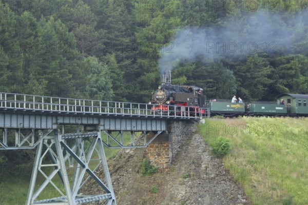 Touristic Fichtelbergbahn with steam locomotive at Hüttenbachtal viaduct, railway bridge, steam