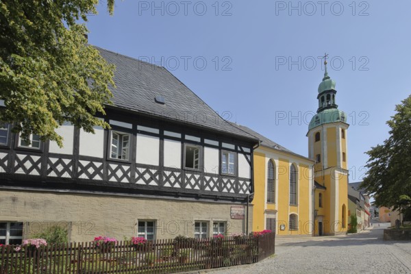 Half-timbered house and late baroque St. Bartholomew church, Wolkenstein, Ore Mountains, Saxony,