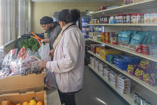Detroit, Michigan USA - 4 November 2025 - People pick up groceries at the nonprofit Deo Gratias
