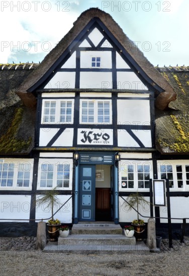 Danish inn, restaurant, in typical half-timbered house with thatched roof on Funen, Fyn island,