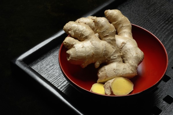 Ginger, ginger root in tea bowl, Zingiber officinale, tea preparation