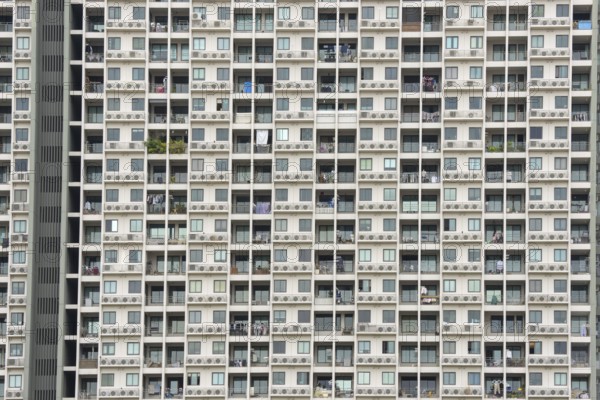 Exterior façade of a residential high-rise building of Condo U (a brand or series name of the Thai