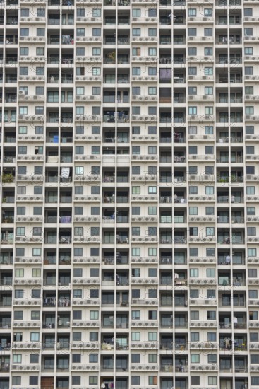 Exterior façade of a residential high-rise building of Condo U (a brand or series name of the Thai