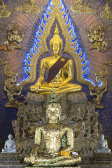 Buddha statue decorated with gold leaf, Bhumispara mudra, Buddha Gautama at the moment of