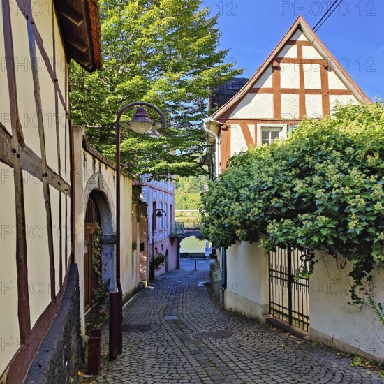 Enge gasse with half-timbered houses in the old town of Unkel, Rotweinstadt, Neuwied district,