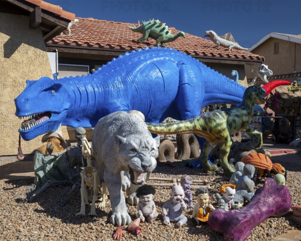 Henderson, Nevada - Dinosaurs dominate the yard of a house in suburban Las Vegas, placed there by
