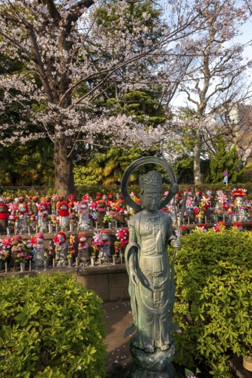 Jizo statues with red crocheted caps, guardian deities for deceased children, Unborn Children