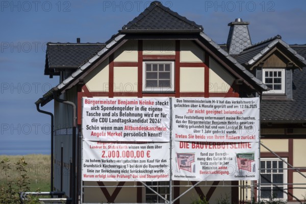 Accusatory posters about donation scandals at a house on the Darß, Meckelnburg-Western Pomerania,