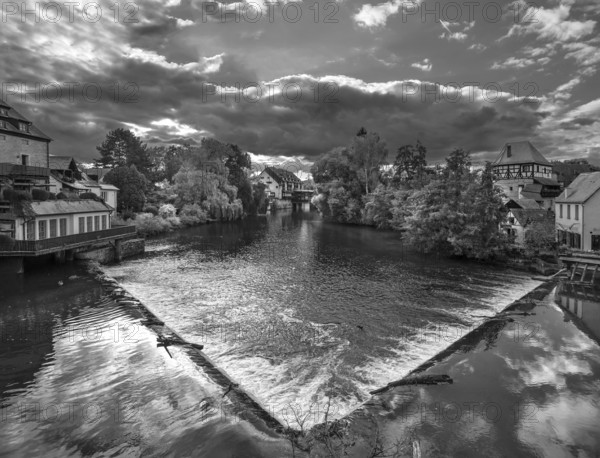View of the Pegnitz with the river weir, on the right the historic Jewish Tower, black and white,