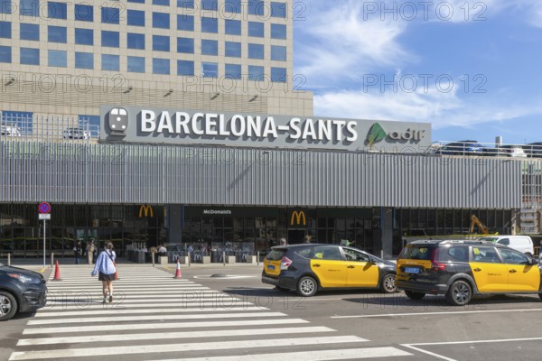 Taxis in street outside Barcelona-Sants railway station building in city centre, Barcelona,
