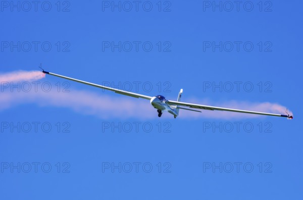 An SZD-59-1 ACRO glider, registration D-1138, during a demonstration as part of an air show at the
