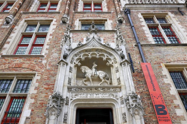 Gruuthusemuseum with equestrian statue of Lodewijk van Gruuthuse above the entrance portal in the