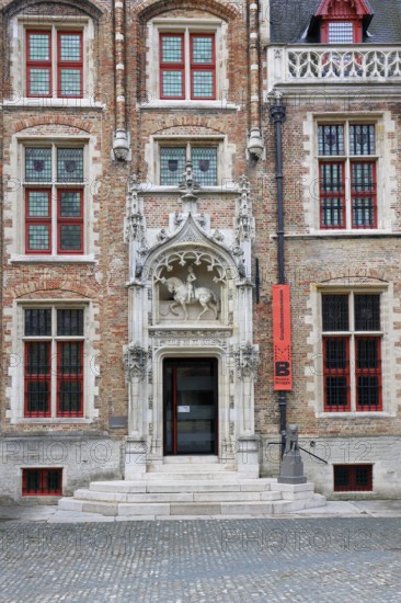 Gruuthusemuseum with equestrian statue of Lodewijk van Gruuthuse above the entrance portal in the