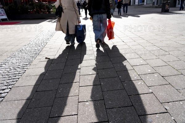 Shadows of passers-by shopping in the city center, Essen, North Rhine-Westphalia