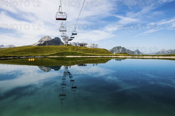 Mountain landscape with reservoir and chairlift, Saloberkopf, Warth, Bregenzerwald, Vorarlberg,