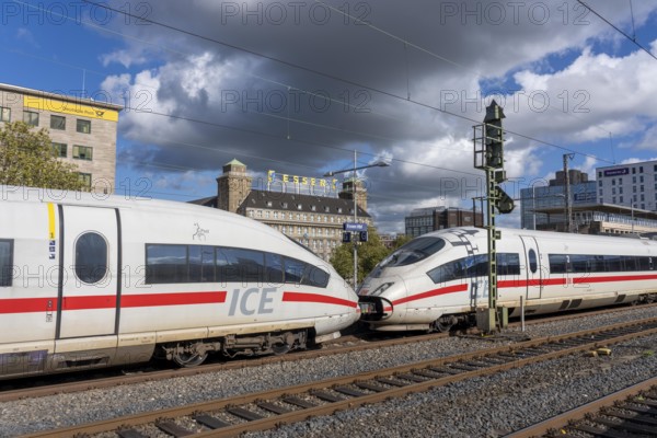 ICE train on track 2 in Essen main station, view of the city center, Handelshof building with Essen