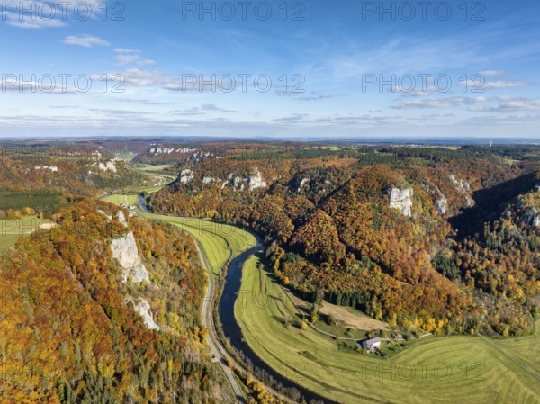 Aerial view of Upper Danube Valley surrounded by autumn vegetation, on the horizon Werenwag Castle,