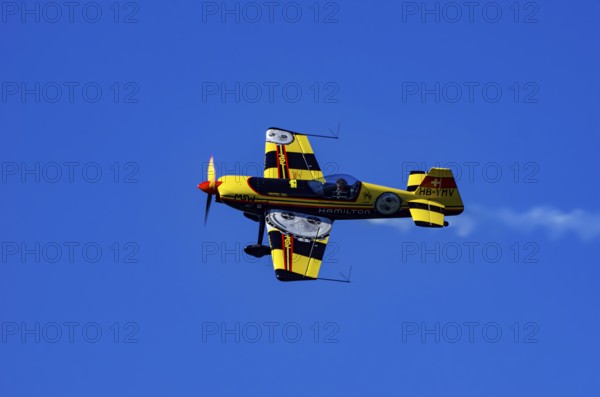 A Votec 351 sport aircraft from the Swiss MSW Aviation AG with registration HB-YMV during a flight