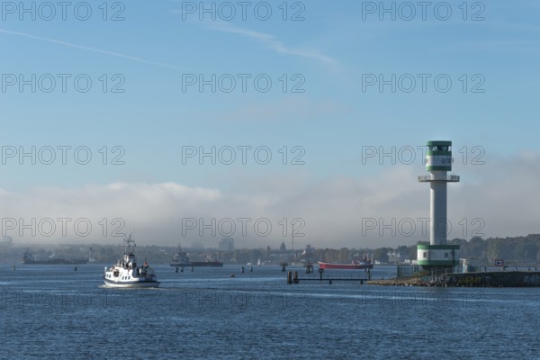 Green-white lighthouse Friedrichsort with city panorama of the state capital, Kiel Fjord, Kiel,