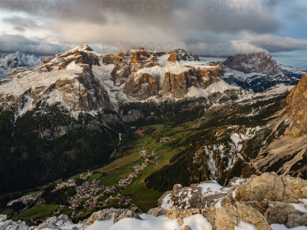 Sella group with fresh snow above the green Val Badia valley, Langkofel on the right, Dolomites,