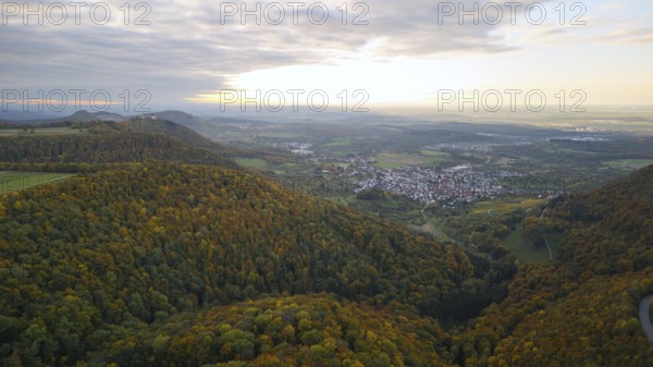 Indian summer at sunset on Albtrauf with a view of the Hohenneuffen castle ruins
