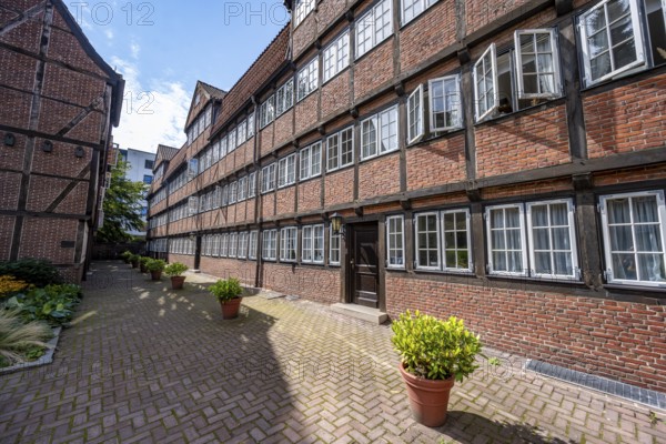 Facades of the historic brick buildings, inner courtyard, view over the city, Peterstraße,