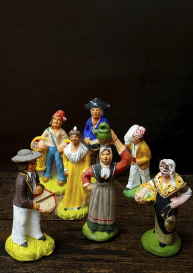 Colorful Provençal terracotta figurines represent traditional characters from rural life. Each
