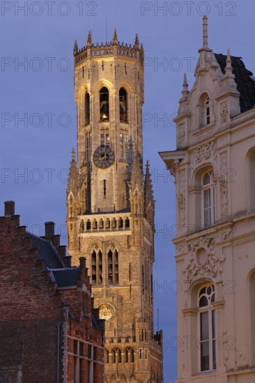 Illuminated Belfry in the historic city centre of Bruges in the evening light, Belfort on the Grote