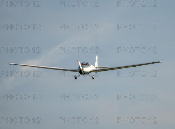 SF-25C Rotax Falke disc motor glider flying over Düsseldorf Airport, North Rhine-Westphalia,