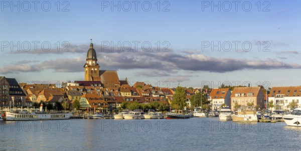 Panoramic view of the city of Waren (Müritz) with a view of the harbor from the water in sunny