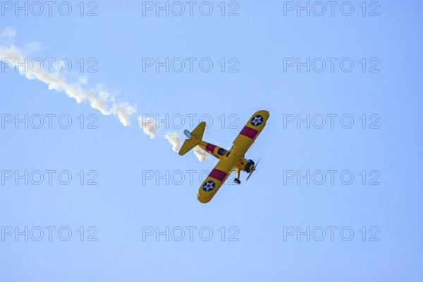 A Boeing-Stearman biplane during a flight demonstration as part of an air show at the Rossfeld in