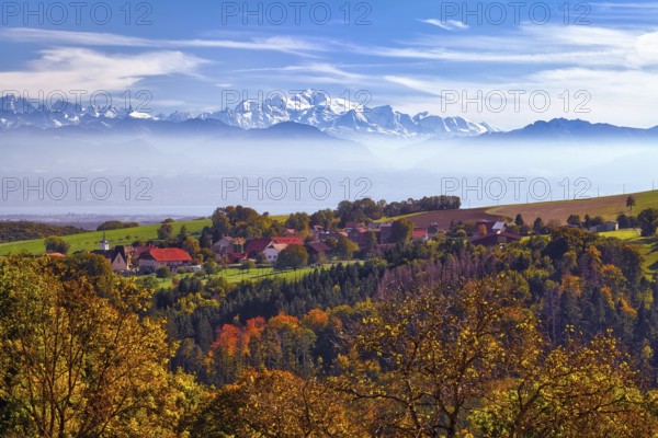 Village of Juriens in the Vaud Jura with view of Mont Blanc, haze over Lake Geneva, autumn-coloured