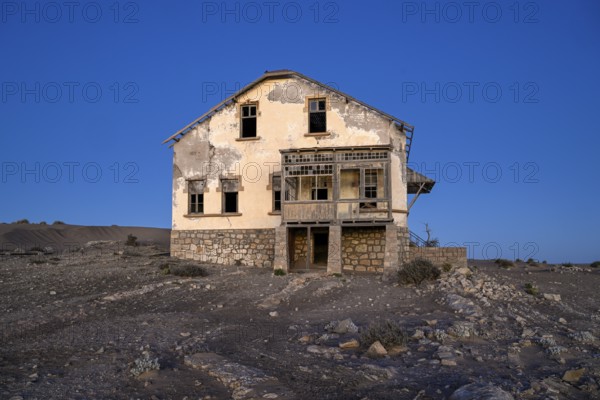 Dilapidated building in the desert sand, blue hour, Kolmanskop, near Lüderitz, Karas region,